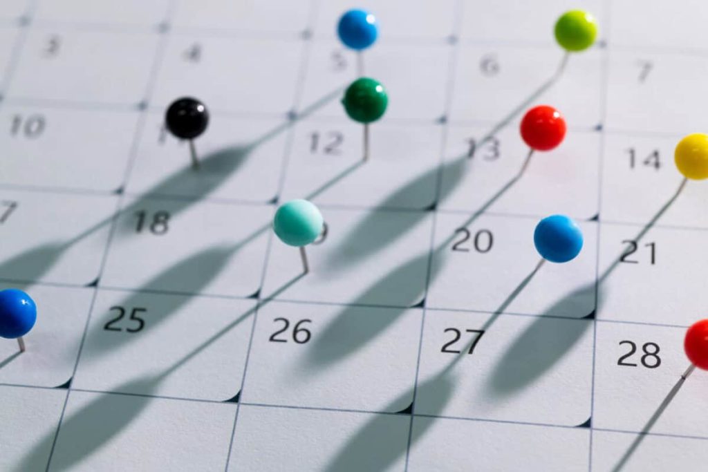 A Monthly-Paying TSX Stock With a 7.9% Dividend Yield Worth Adding to Your Radar in June 2026 Colored pins on calendar showing a month